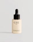 30ml dropper bottle of CZE Hair Nourishing Perfume Oil – lightweight leave-in hair treatment for shine and scent