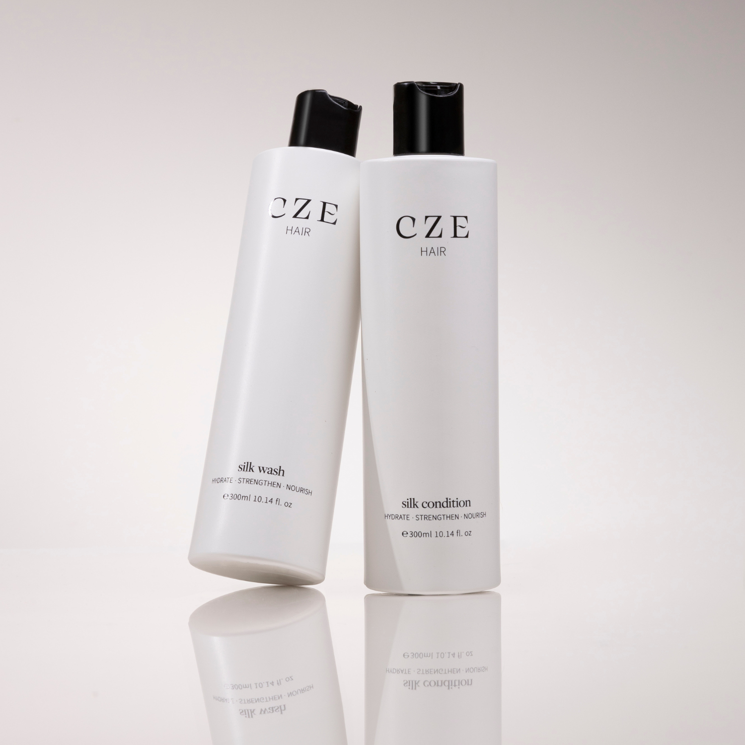 CZE Hair Silk Wash and Silk Condition bottles – hydrating and strengthening shampoo and conditioner duo